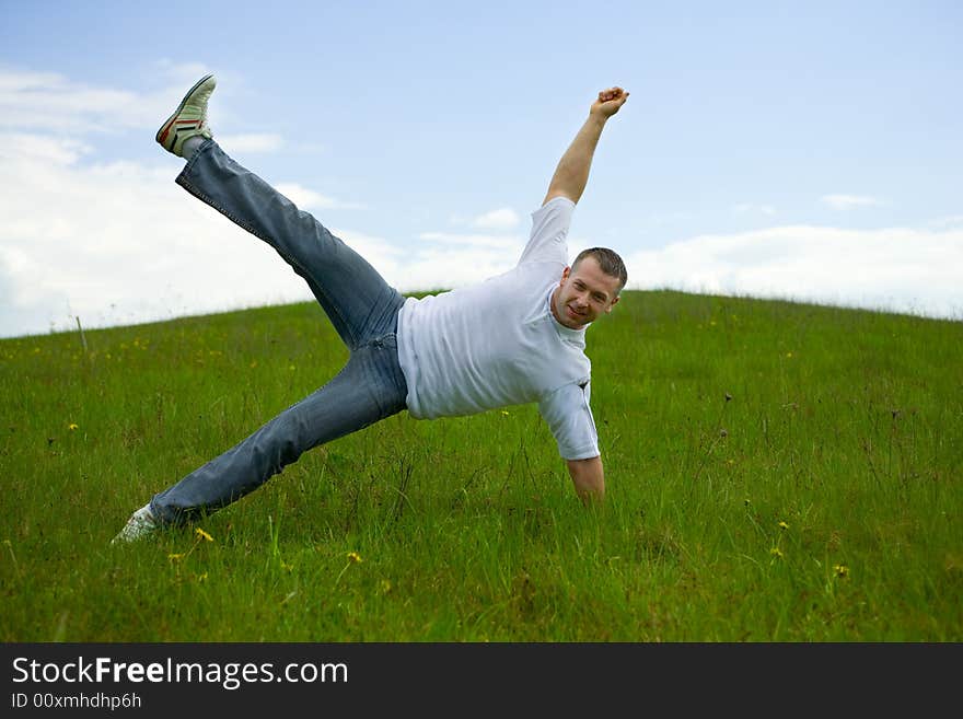 The man jumping on a lawn