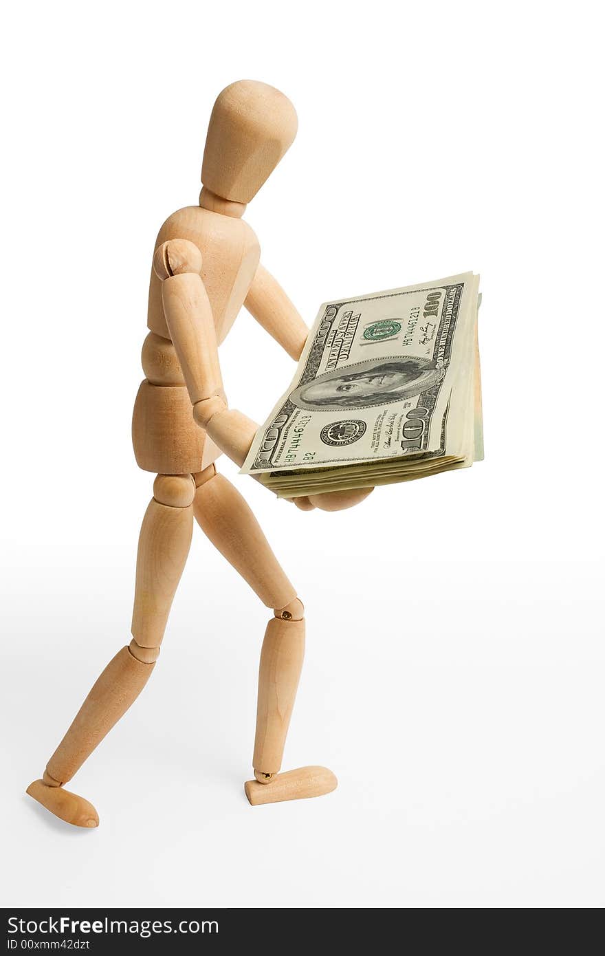 The wooden figure holds dollars.Isolated on white [with clipping path]. The wooden figure holds dollars.Isolated on white [with clipping path].