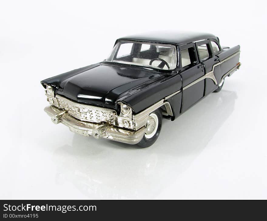 Model of the black car on a white background. Model of the black car on a white background