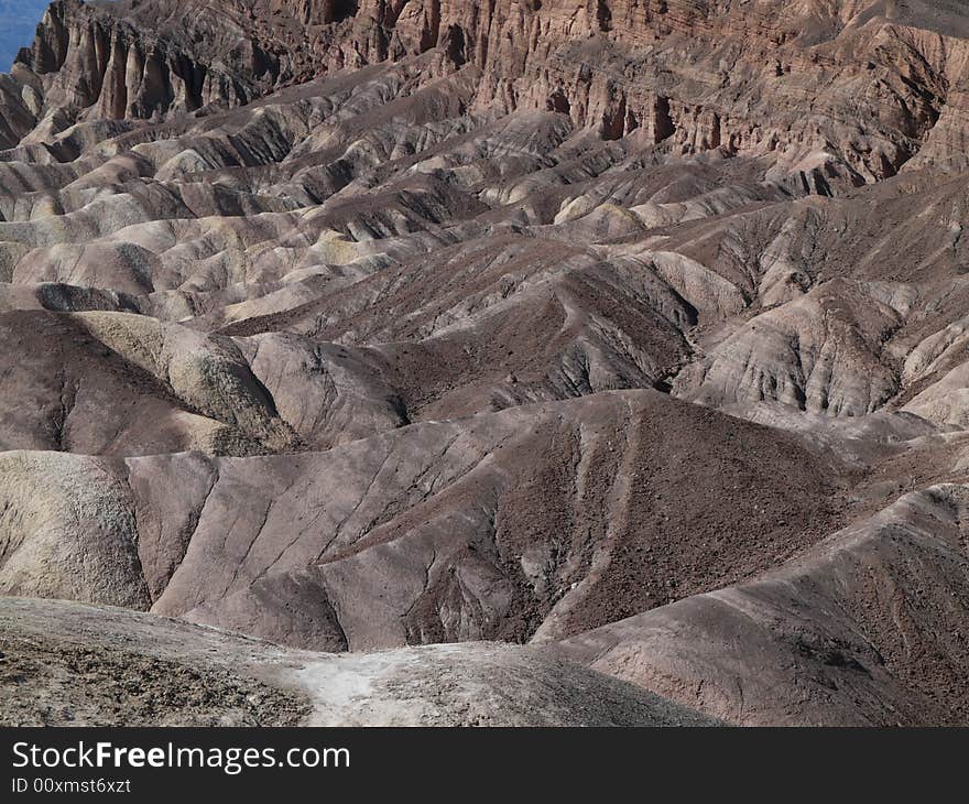 High, unvegetated mountains of sombre reddish colour. 
In Death Valley temperatures can exceed 130°F in summer. High, unvegetated mountains of sombre reddish colour. 
In Death Valley temperatures can exceed 130°F in summer.