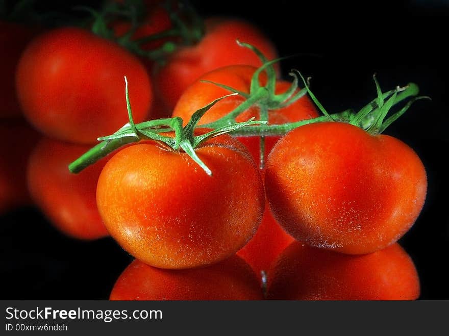 Close up red tomatoes plaсed in a water with air bubbles. Close up red tomatoes plaсed in a water with air bubbles