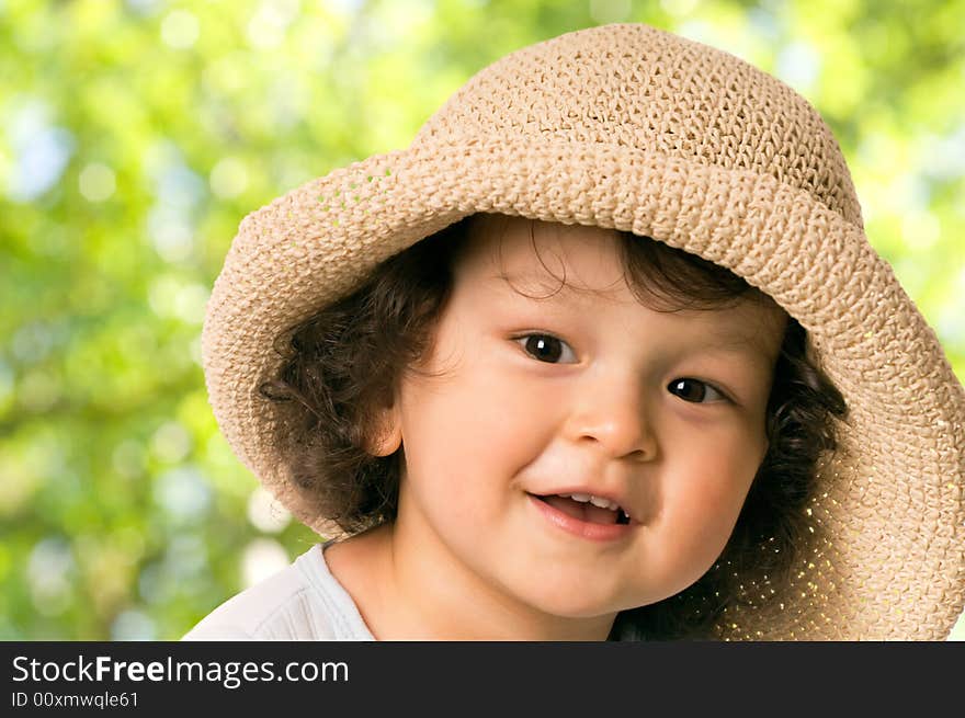 The child in a; straw-hat. The child in a; straw-hat.