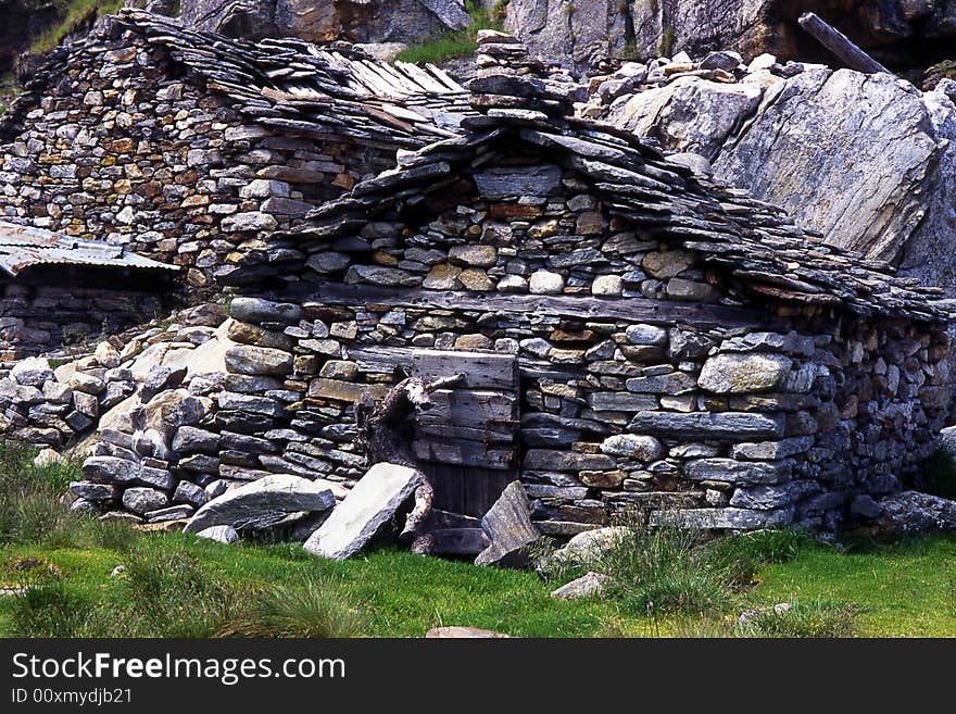 Abandon ruined alpine huts in mountains