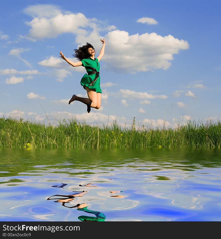 Happy young woman is jumping