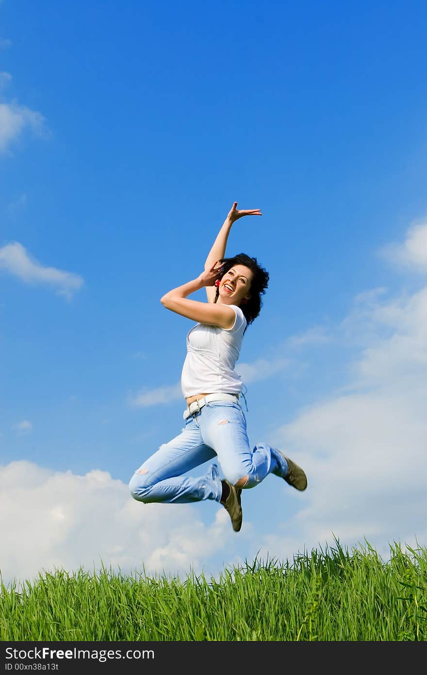 Happy young woman is jumping