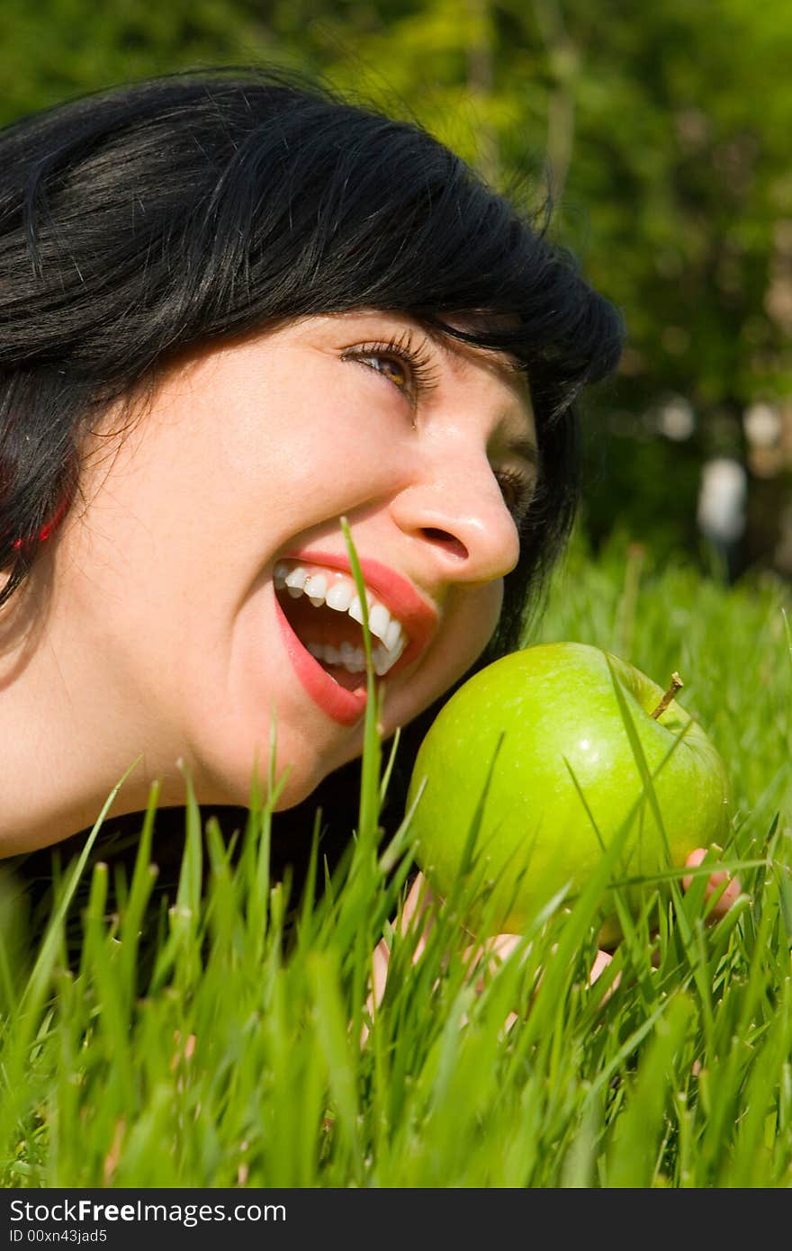 Pretty Woman Eating Green Apple