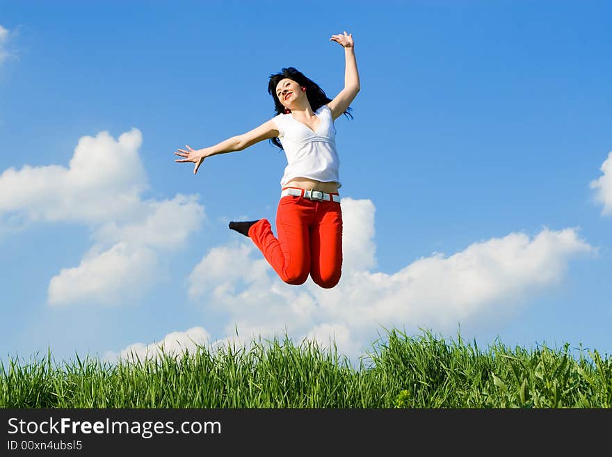 Pretty young woman is jumping