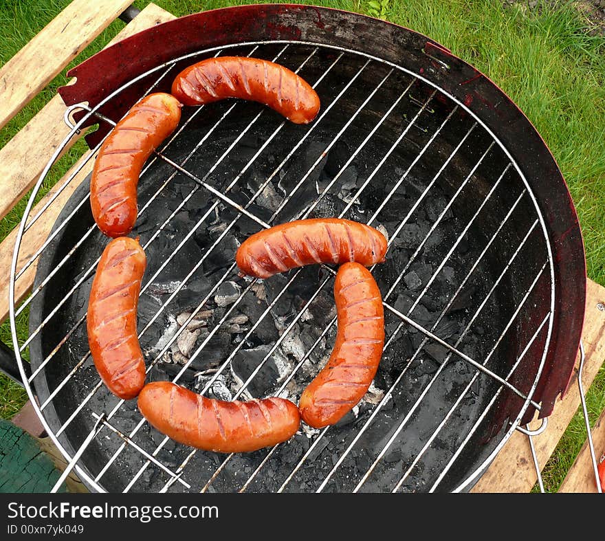 Sausages composition in the form of letter G like grill and grilled. Yummy!. Sausages composition in the form of letter G like grill and grilled. Yummy!