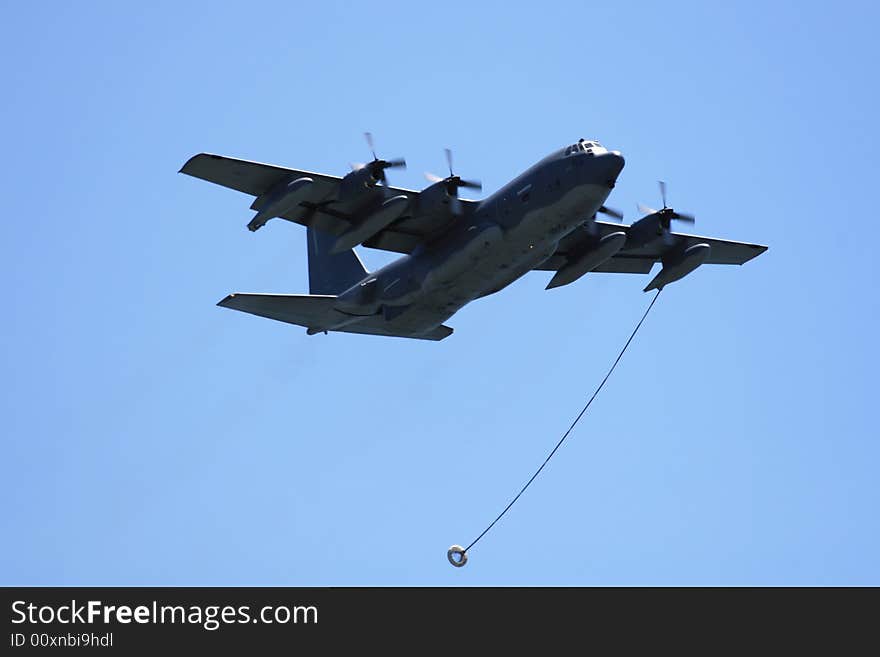 Air National Guard C-130 Hercules fly by, with in air refueling line at Long Island air show