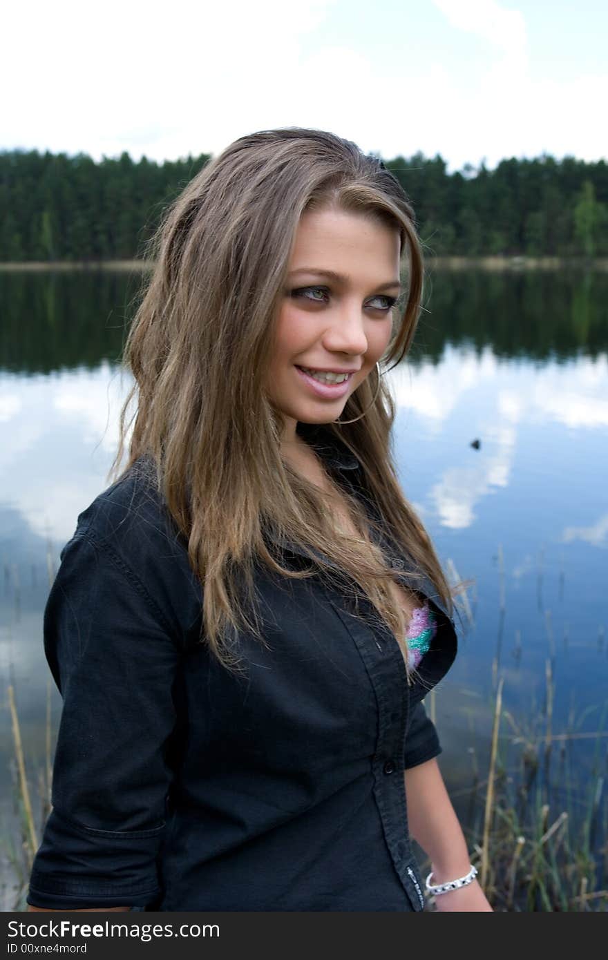 Portrait of young sexual girl on lake background