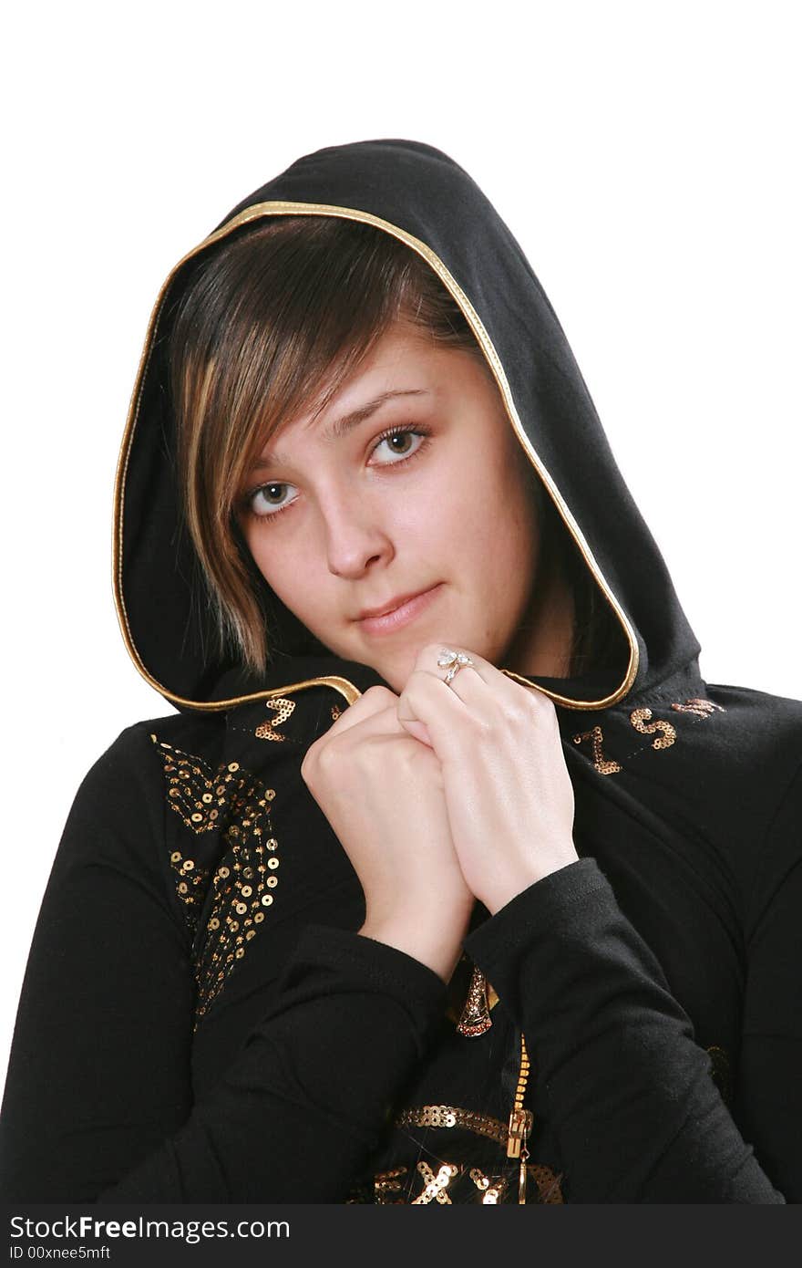 The young woman in a hood has pressed hands to a breast