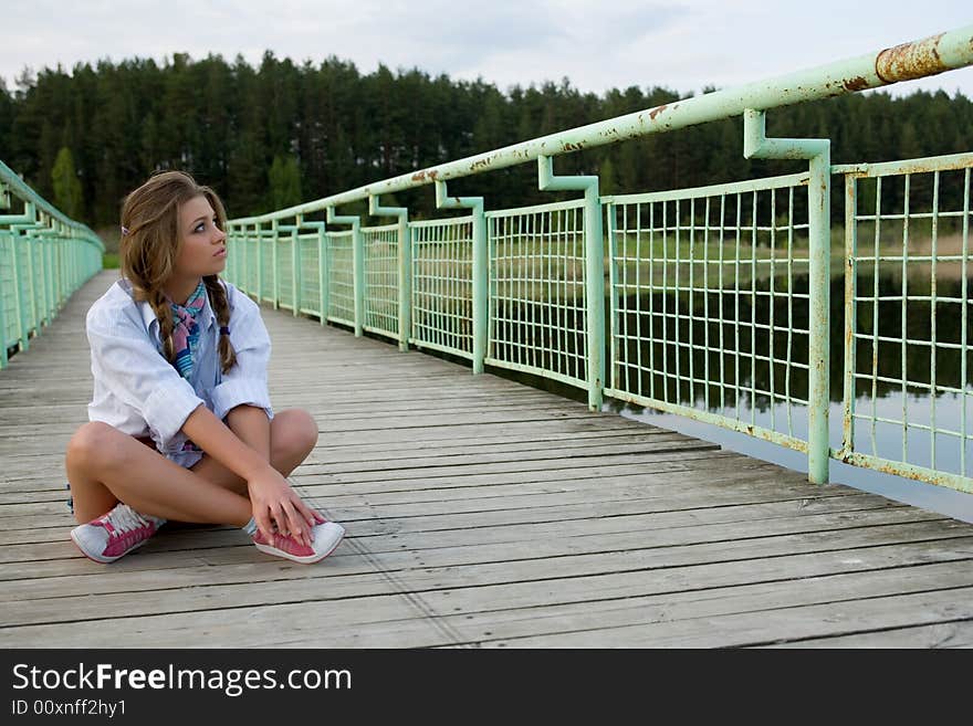 Portrait of young sexual girl on lake background