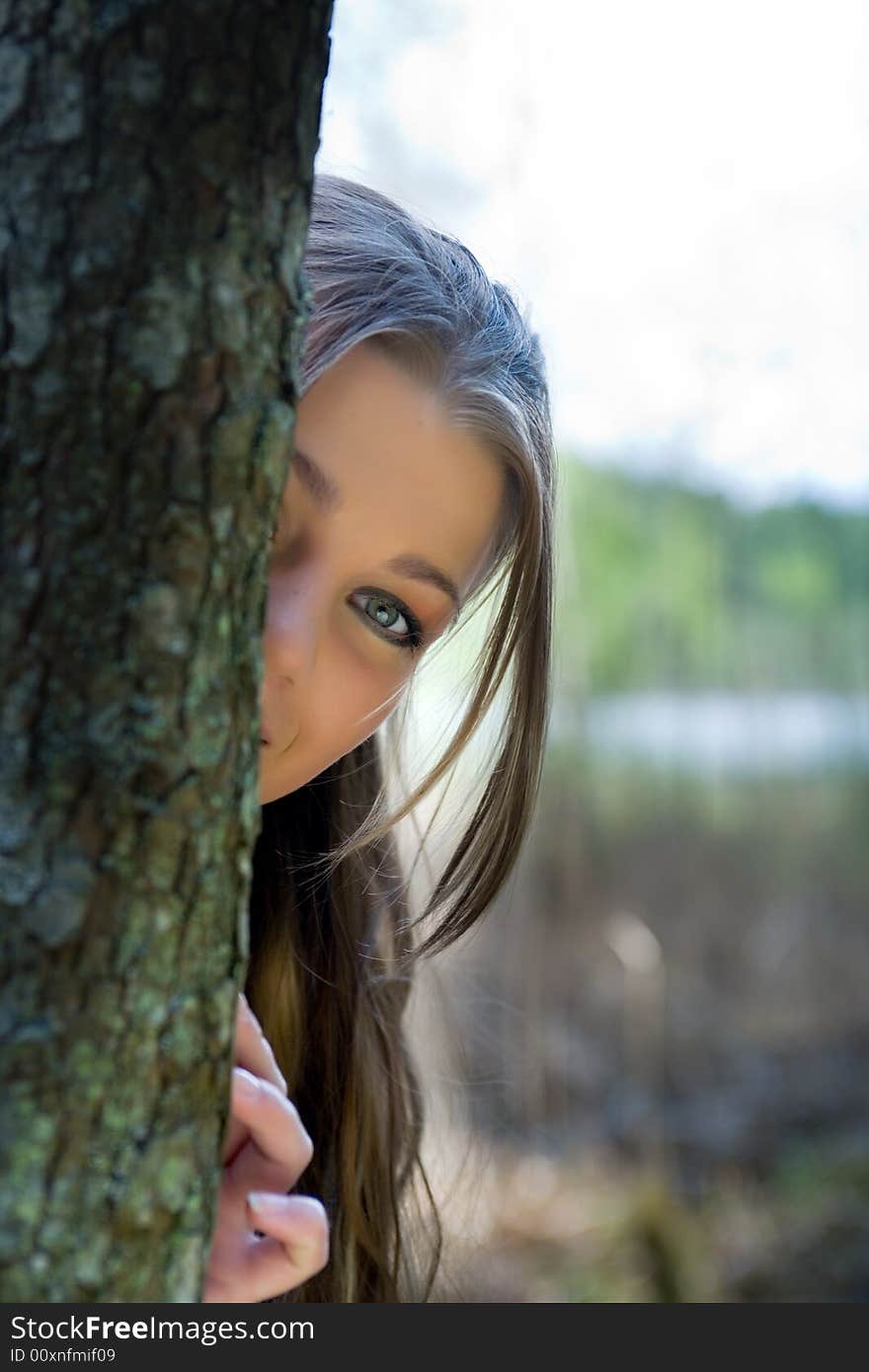 Portrait of young girl on forest background