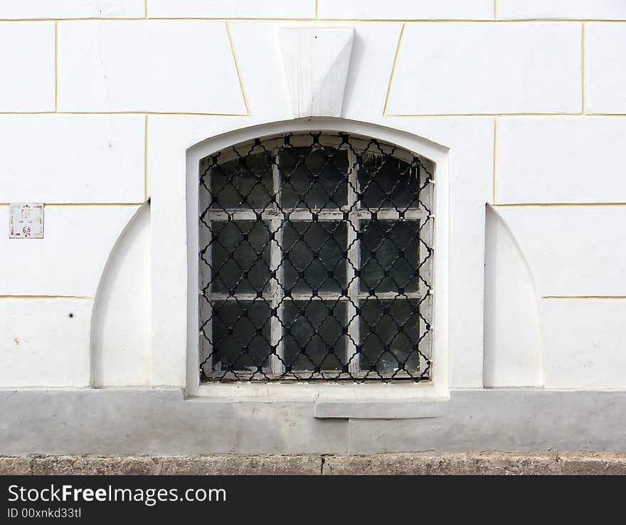 Old window in a wall of a church. Old window in a wall of a church