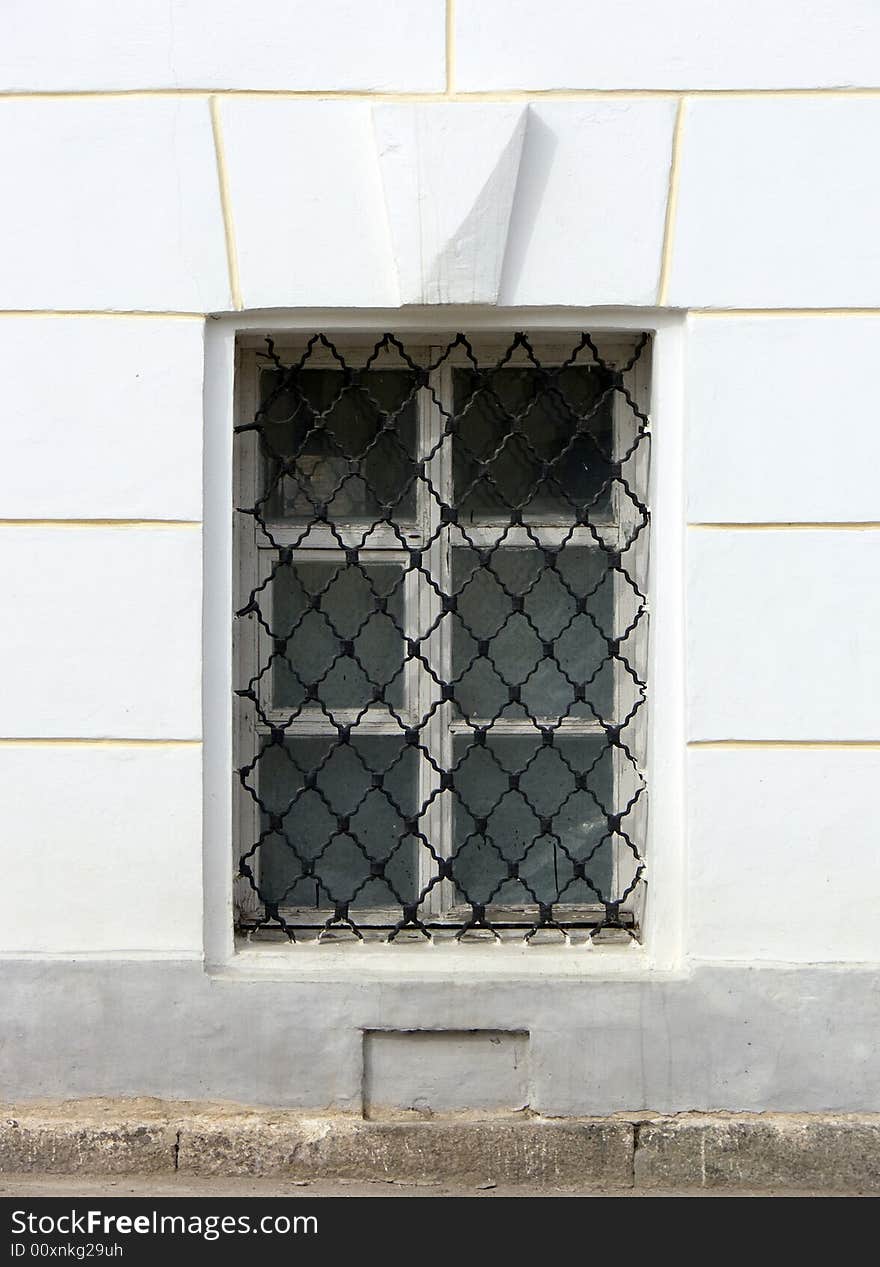 Old window in a wall of a church. Old window in a wall of a church