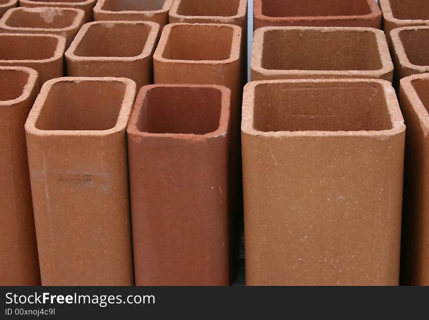 View of terra cotta chimney flues, useful for pattern, design, background for construction, hardware, masonry trades. View of terra cotta chimney flues, useful for pattern, design, background for construction, hardware, masonry trades