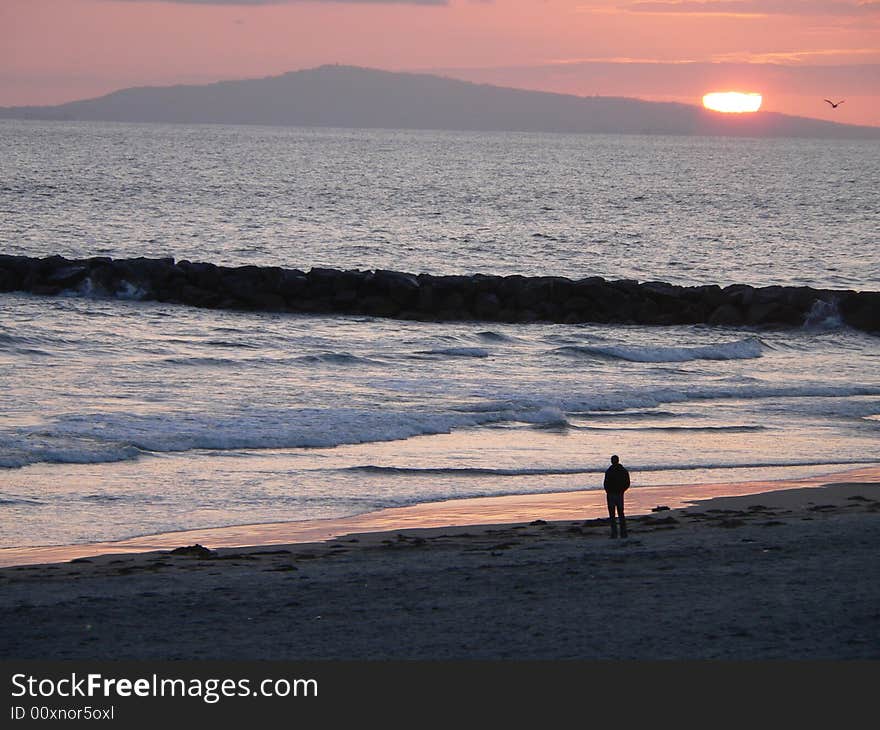 Sunset beyond Santa Catalina Island off the coast of Newport Beach - Landscape. Sunset beyond Santa Catalina Island off the coast of Newport Beach - Landscape