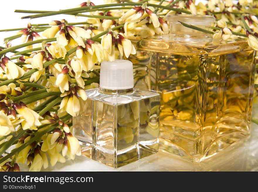 Flowers and bottle with perfume.