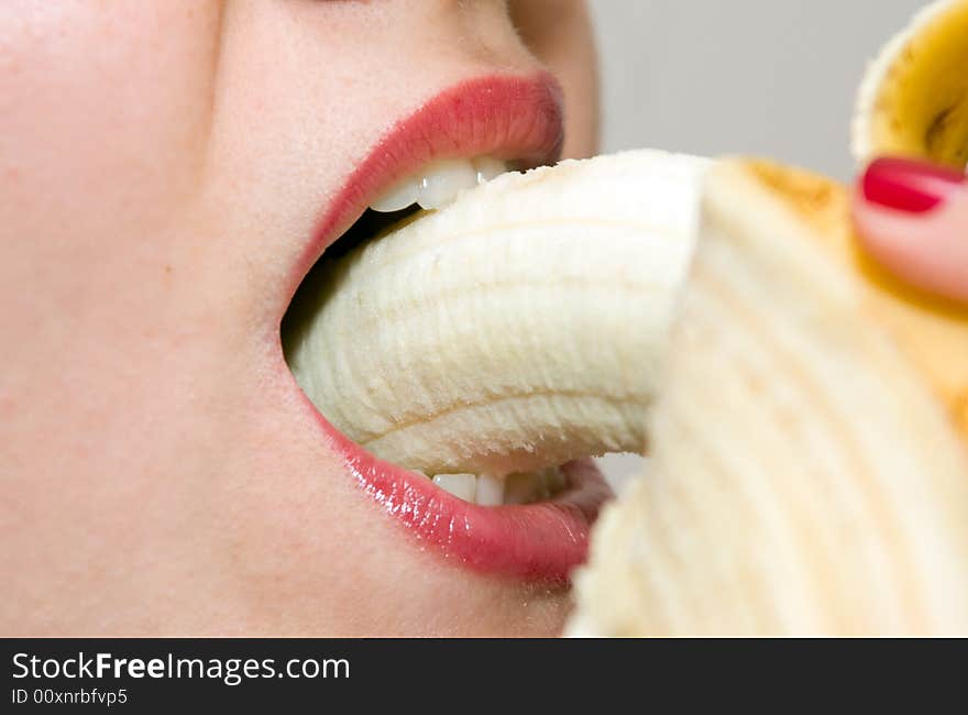 Girl Eating Banana Closeup