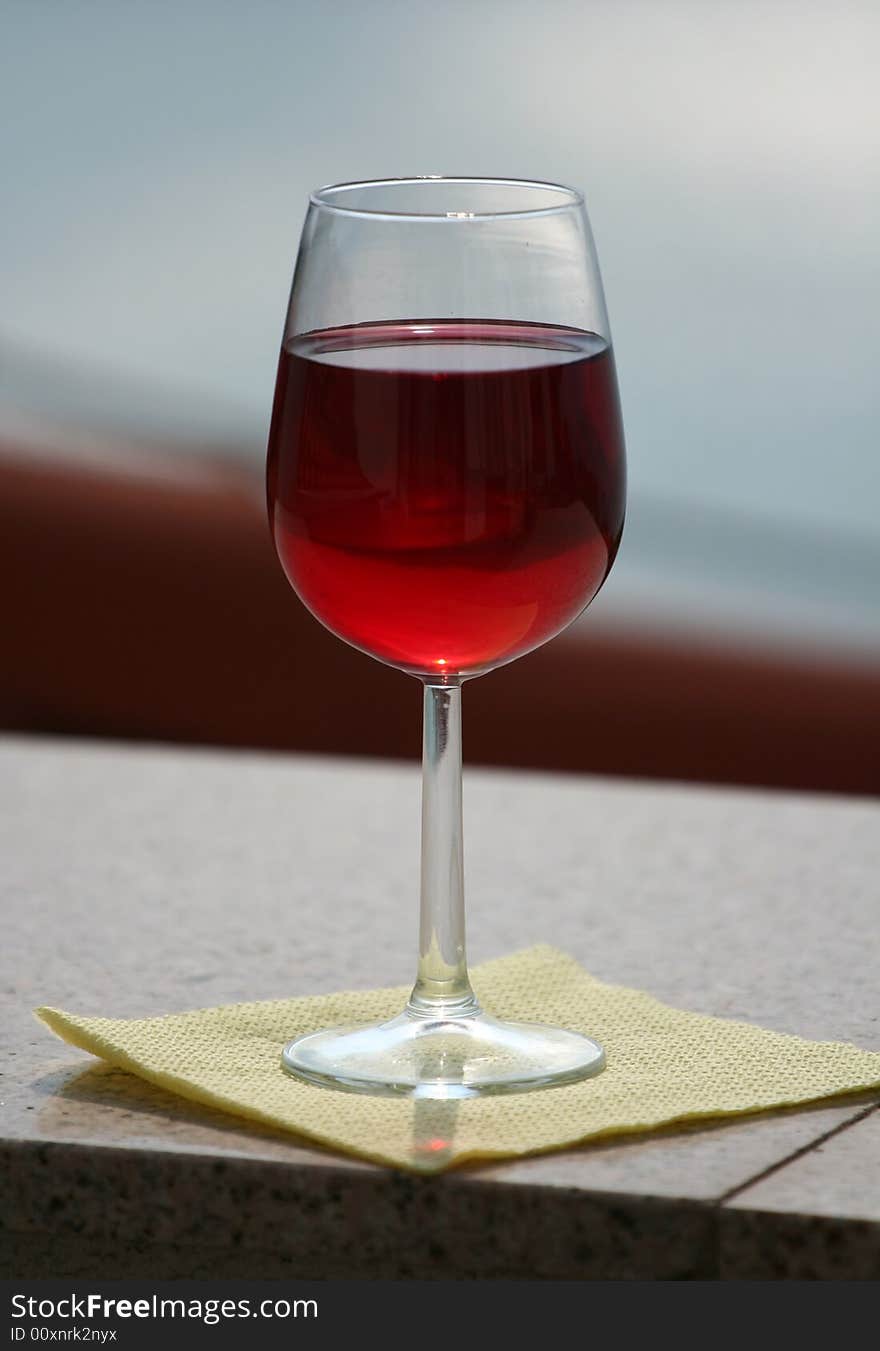 Red wine glass over a dark background. Red wine glass over a dark background