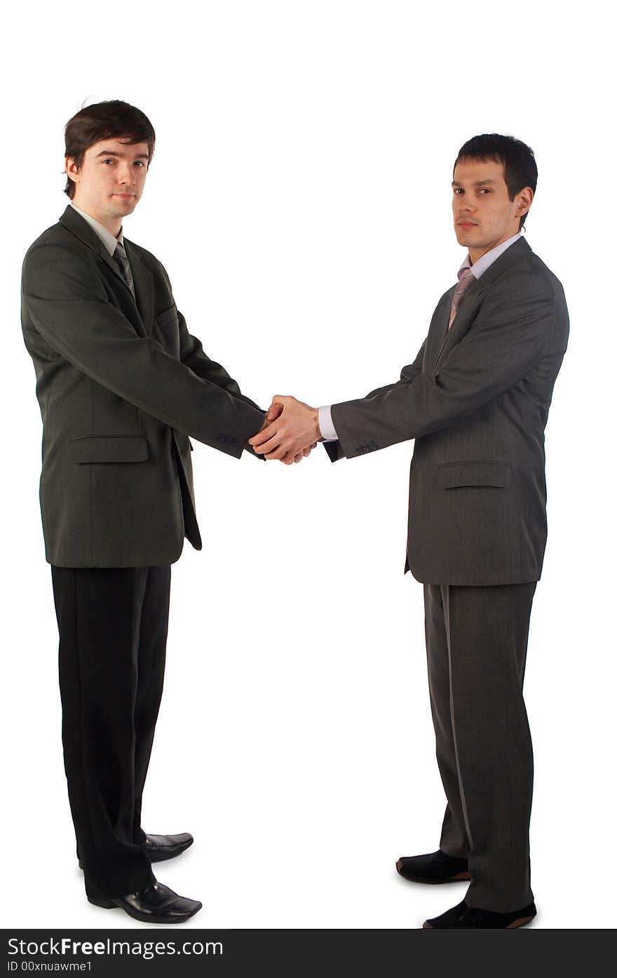 Two young man handshake both hands