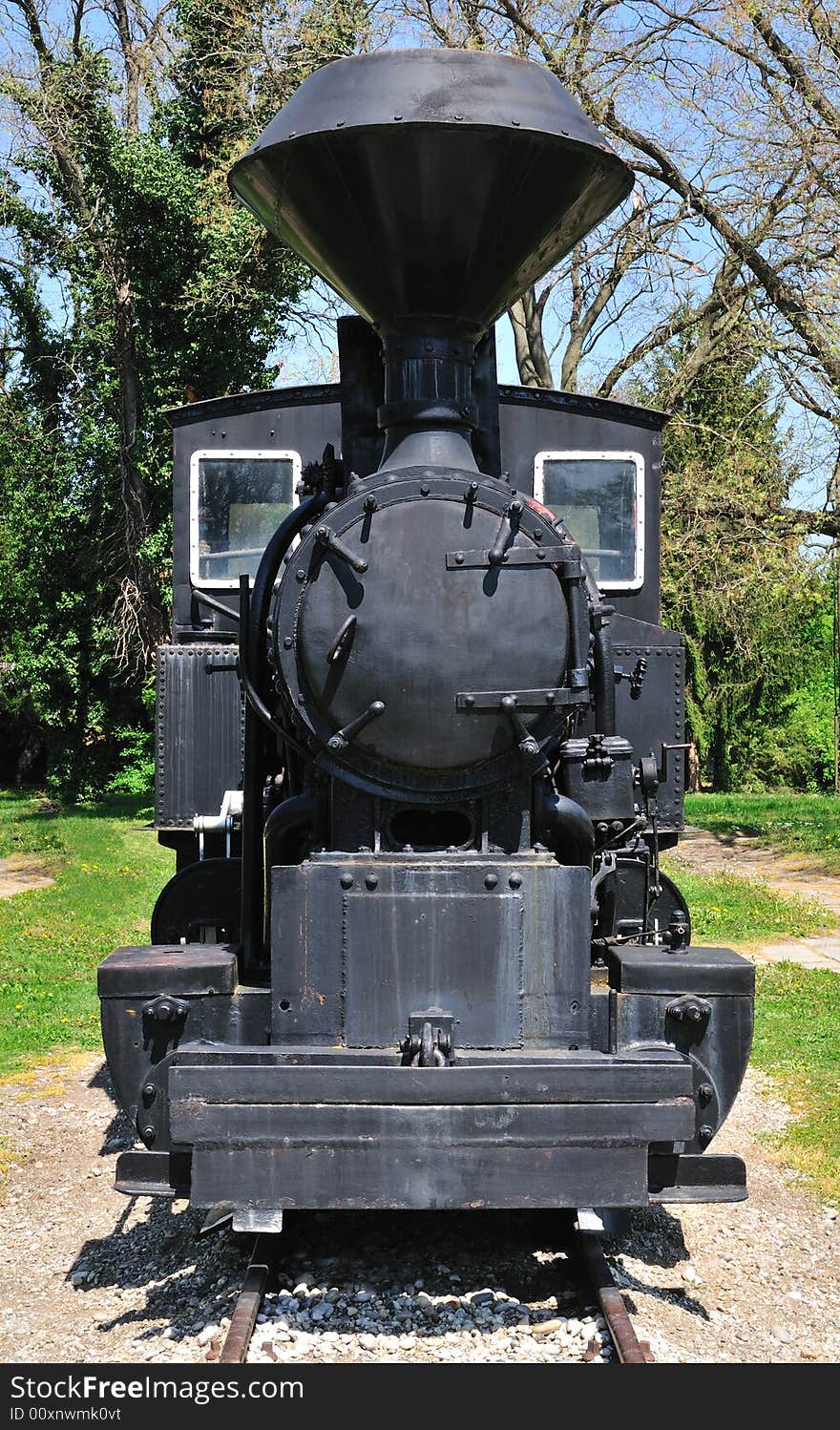 Very old steam locomotive close up at station. Very old steam locomotive close up at station.