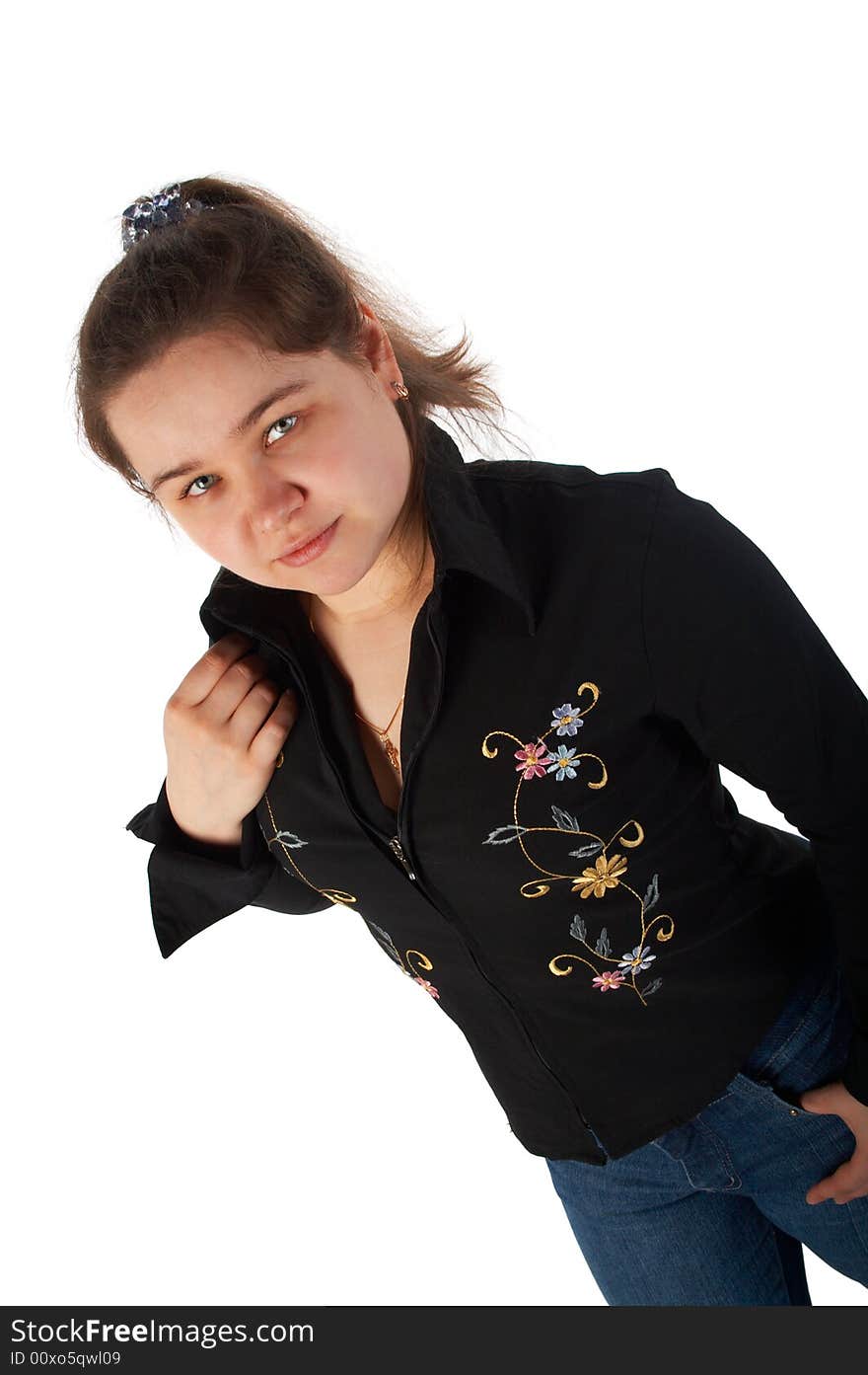 Girl in blue jeans and shirt posing isolated on white