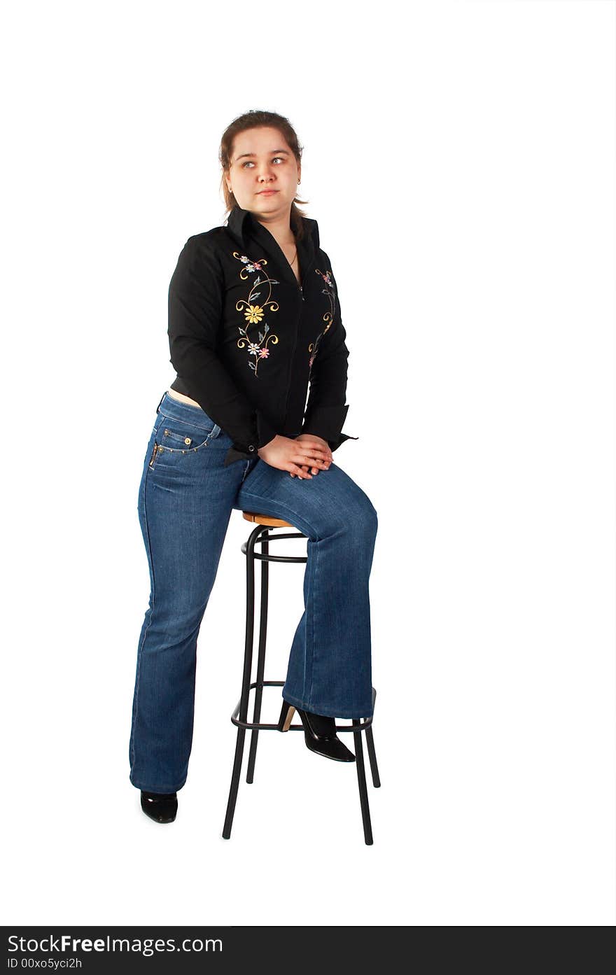 Girl sits on stool