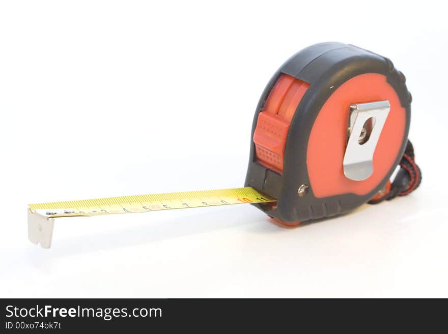 Tape-measure on the white background