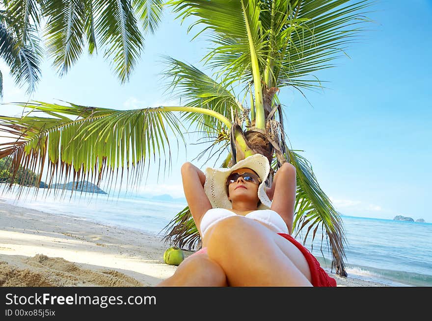 View of nice woman having fun on tropical beach. View of nice woman having fun on tropical beach