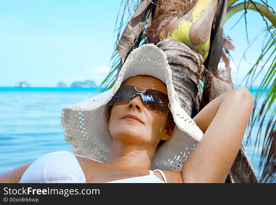 View of nice woman having fun on tropical beach. View of nice woman having fun on tropical beach