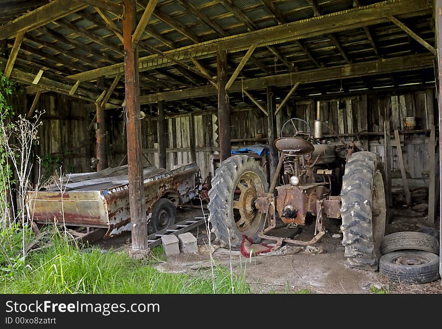 An Old Tractor In An Old Shed. An Old Tractor In An Old Shed