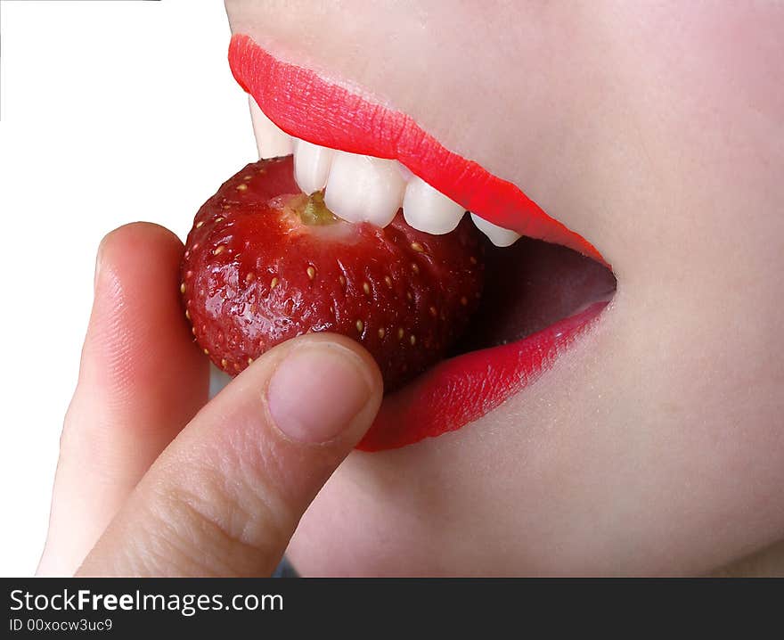 Taste strawberry in woman mouth