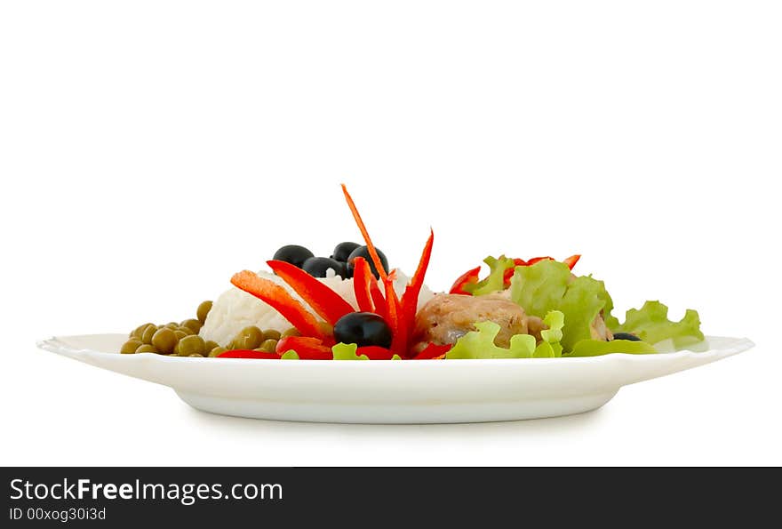 Rice and fried chicken with vegetable (lettuce, pepper,  olives and green peas) decoration. Rice and fried chicken with vegetable (lettuce, pepper,  olives and green peas) decoration.