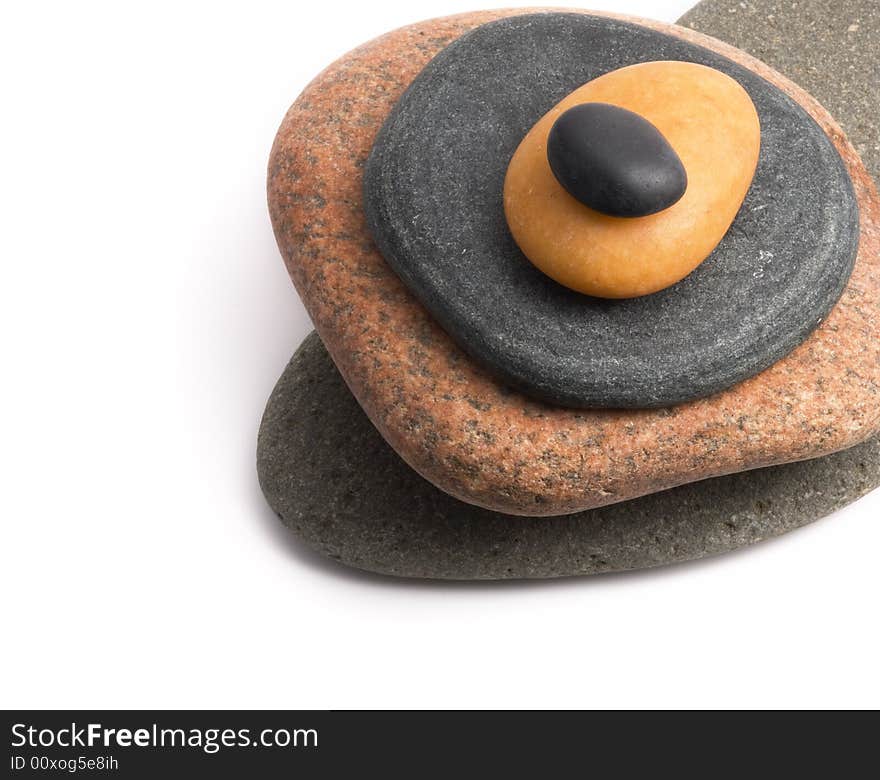 Pile of pebbles close-up on a white background