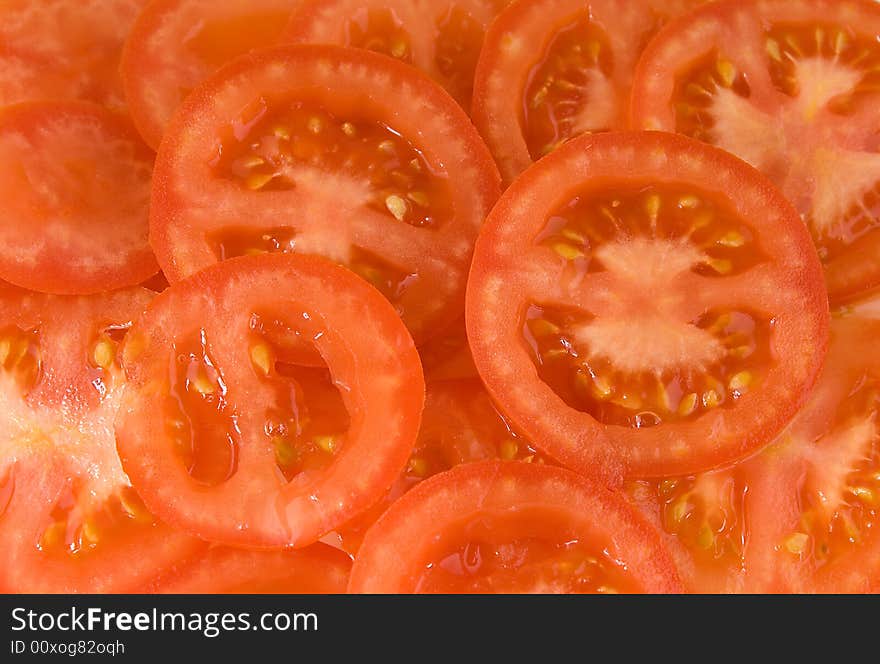 Red background made of tomatos. Red background made of tomatos