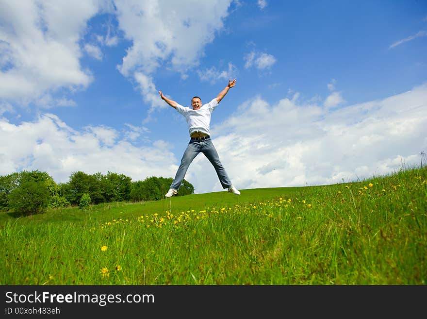 The man jumping on a lawn