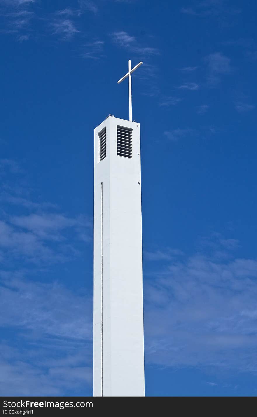 Church bell tower in the blue sky in cap ferret France. Church bell tower in the blue sky in cap ferret France