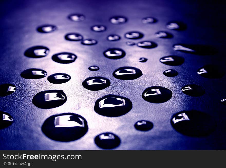 Drops of the water on a book cover. Drops of the water on a book cover