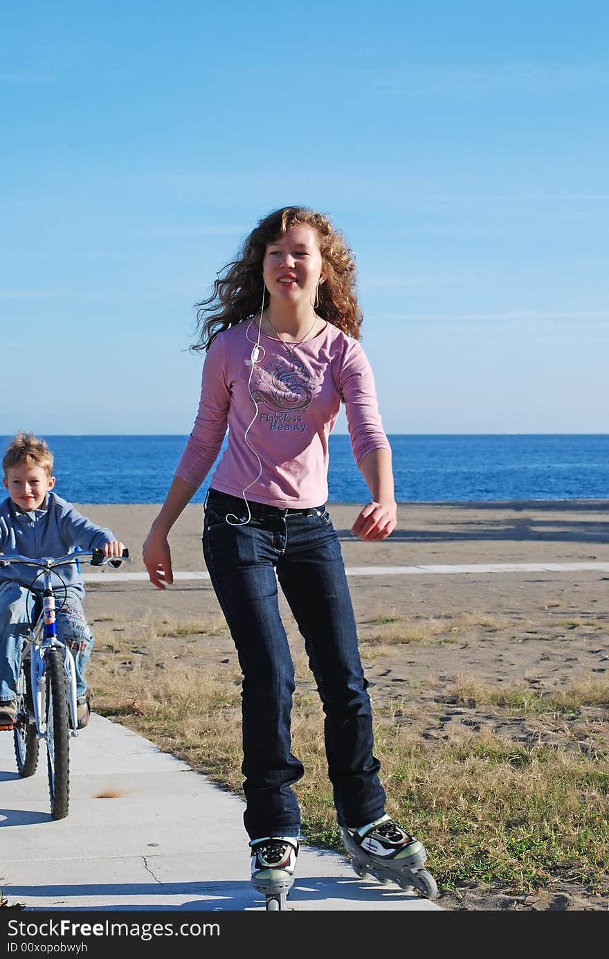 The brother and the sister go for a drive on coast of ocean. The brother and the sister go for a drive on coast of ocean