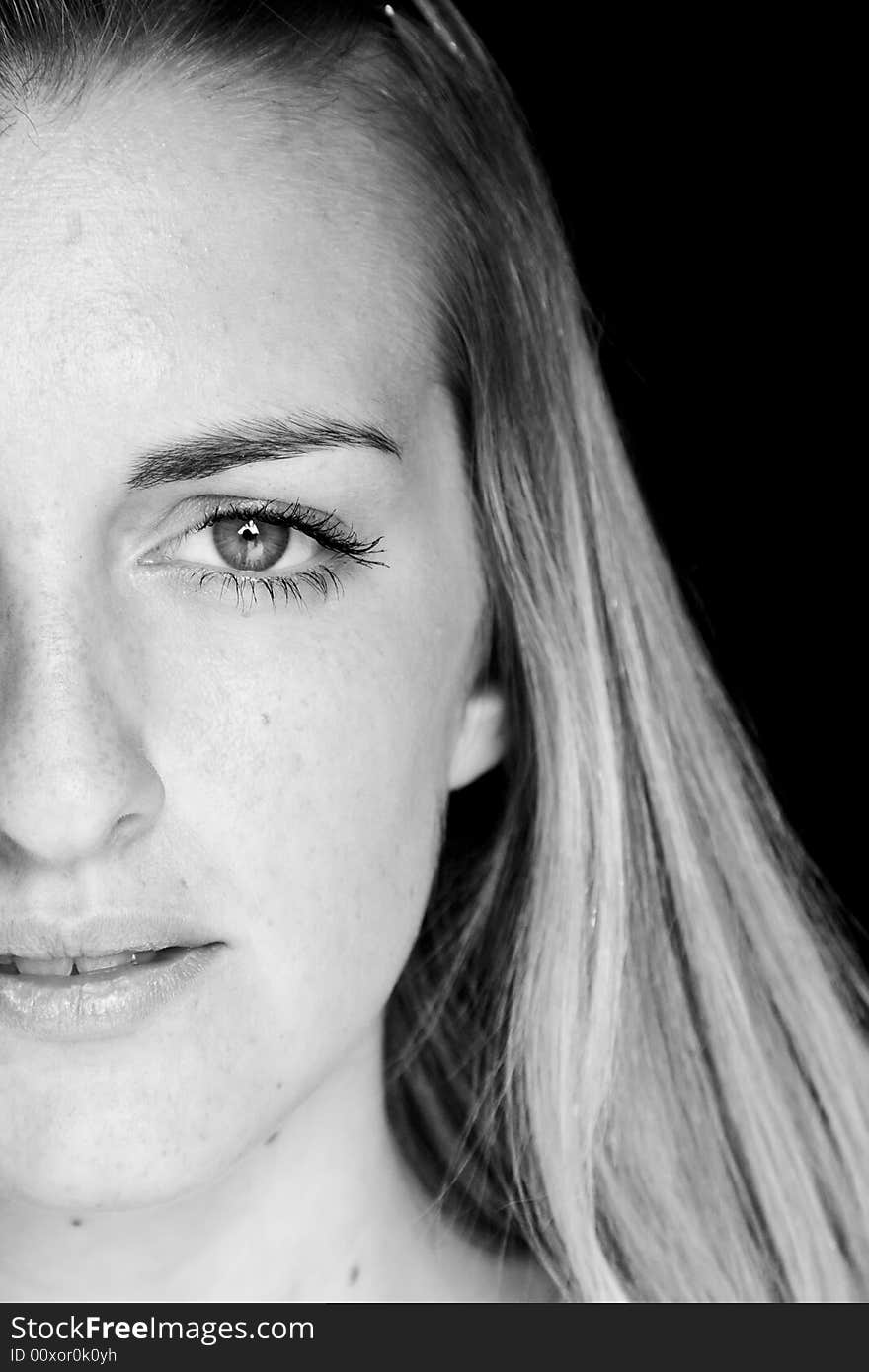 Young woman close portrait in black and white.