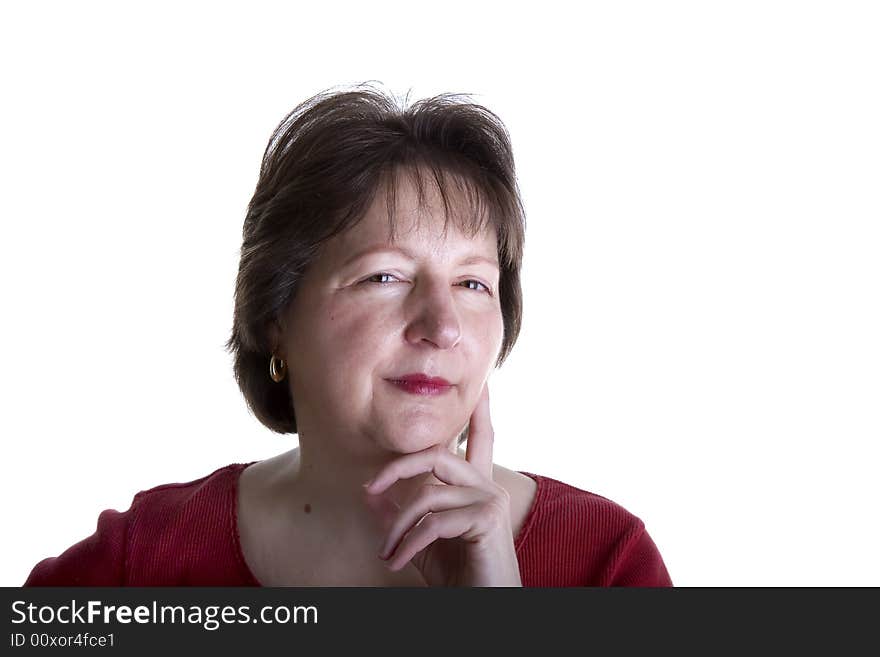 A nice looking middle-aged woman in red with a thoughtful expression. A nice looking middle-aged woman in red with a thoughtful expression