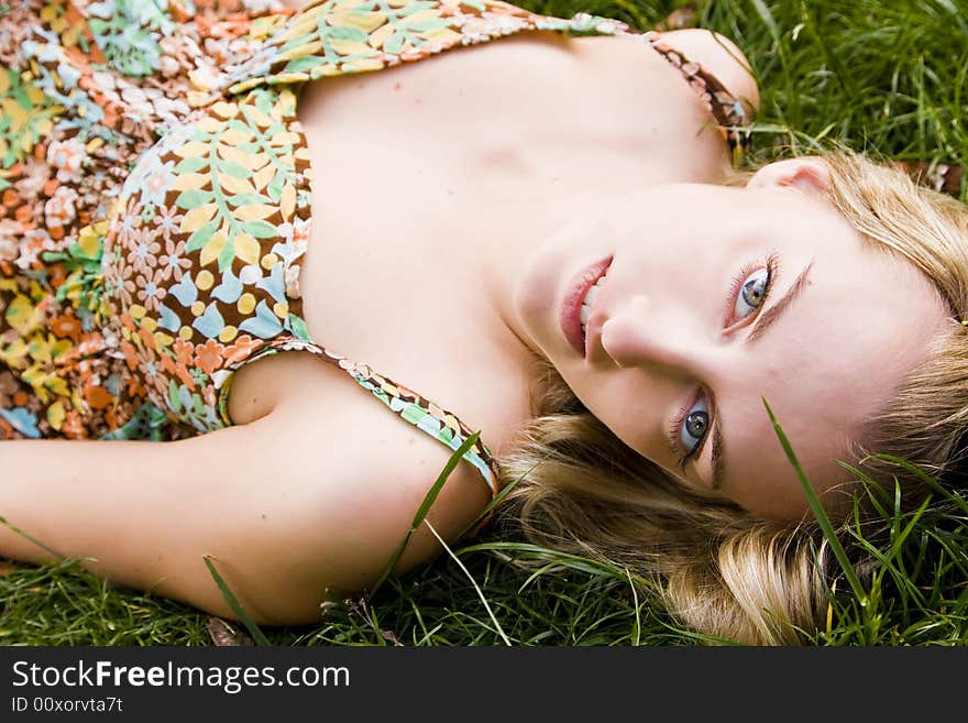 Impressive green eyed beauty on the grass. Impressive green eyed beauty on the grass