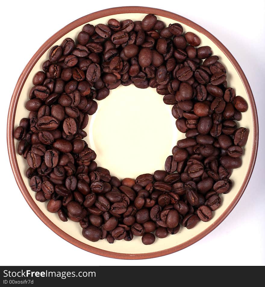 Saucer with coffee beans