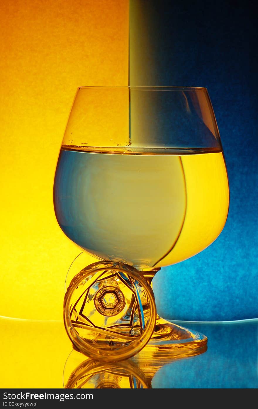 Two glasses on yellow-blue background