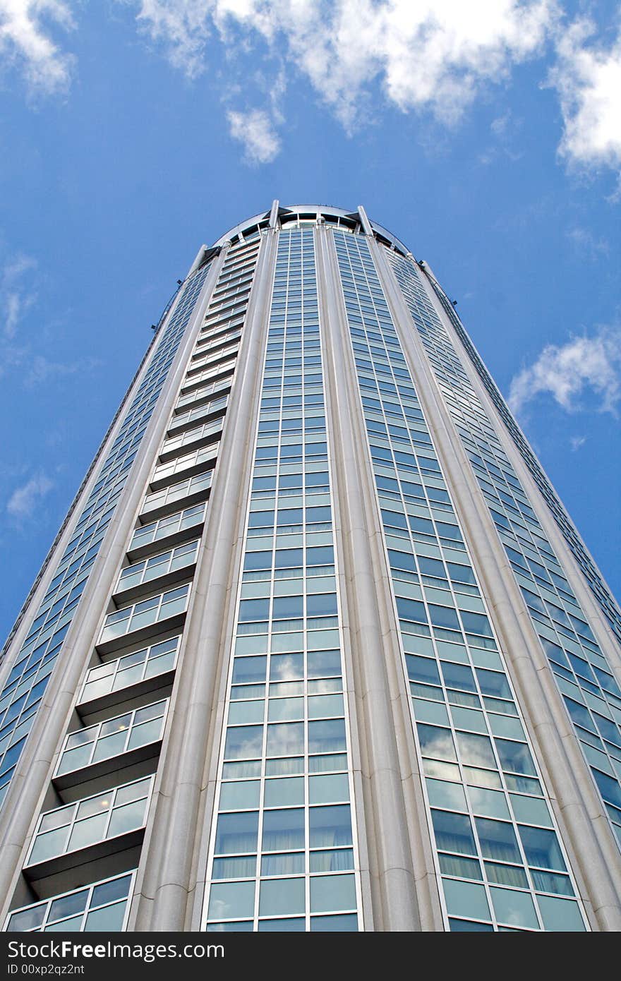 High modern building with reflecting windows.