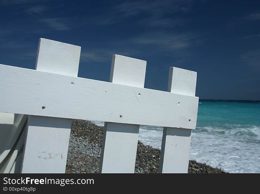 Beach and white fence