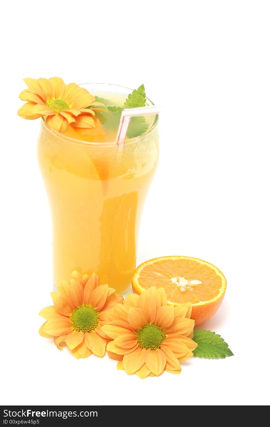 Glass of orange juice,flowers and fresh mint against white background. Glass of orange juice,flowers and fresh mint against white background