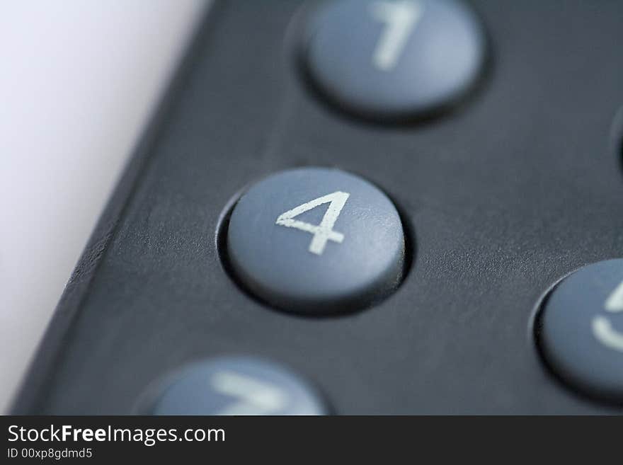 A close up of a number four button on a remote control