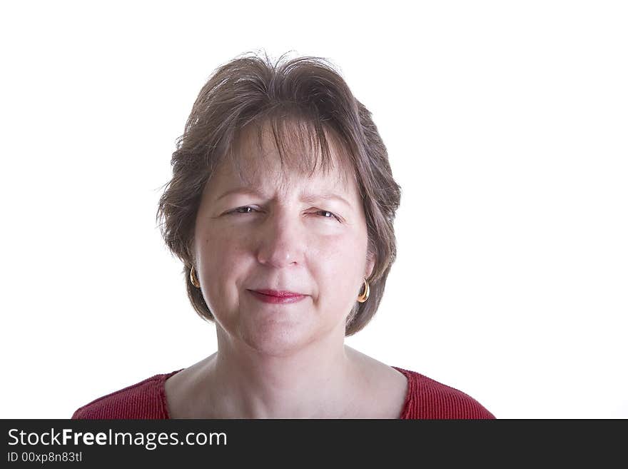 A woman in red on white background with a mad expression. A woman in red on white background with a mad expression